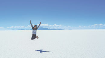 Student jumping in the desert sun